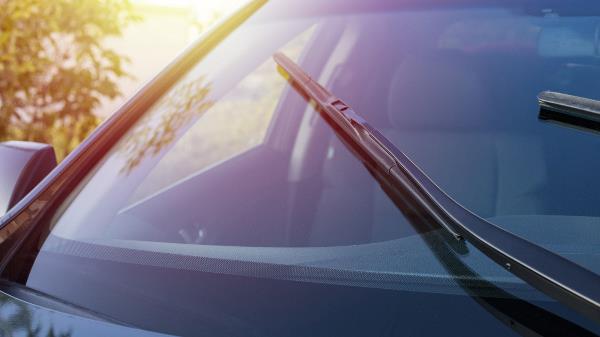 Car windshield with wiper blades